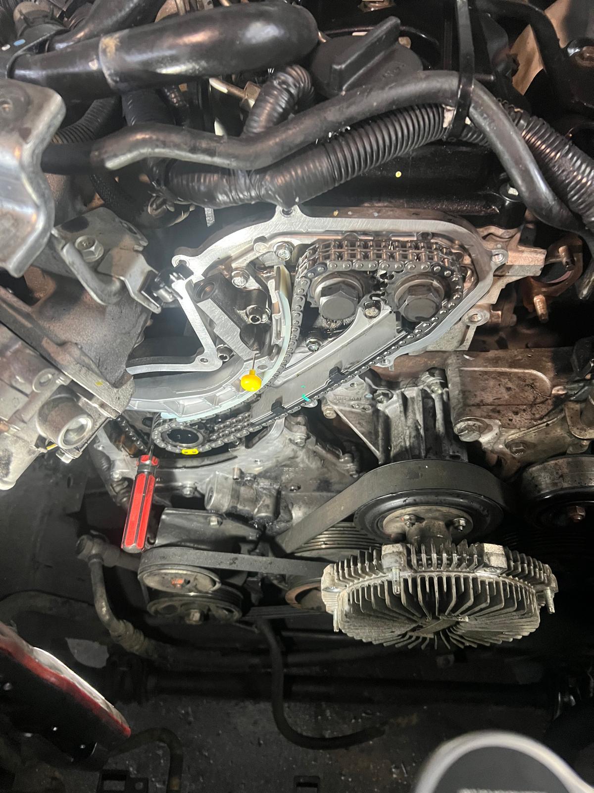 Timing chain and sprockets exposed on the front of the engine